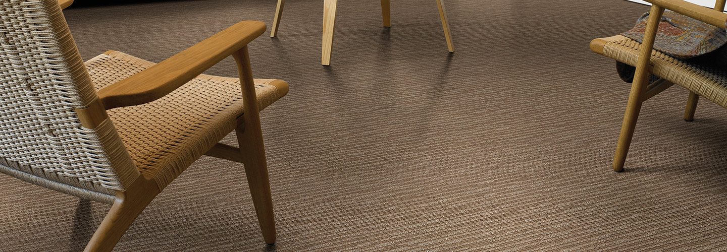 Living room scene with brown American Showcase carpet.