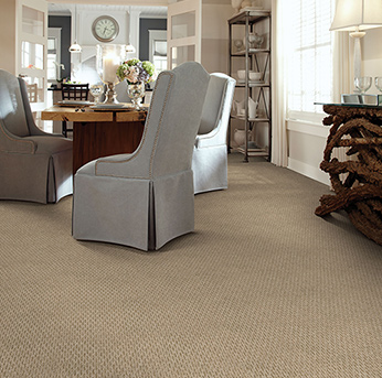 Dining room scene with tan American Showcase carpet.